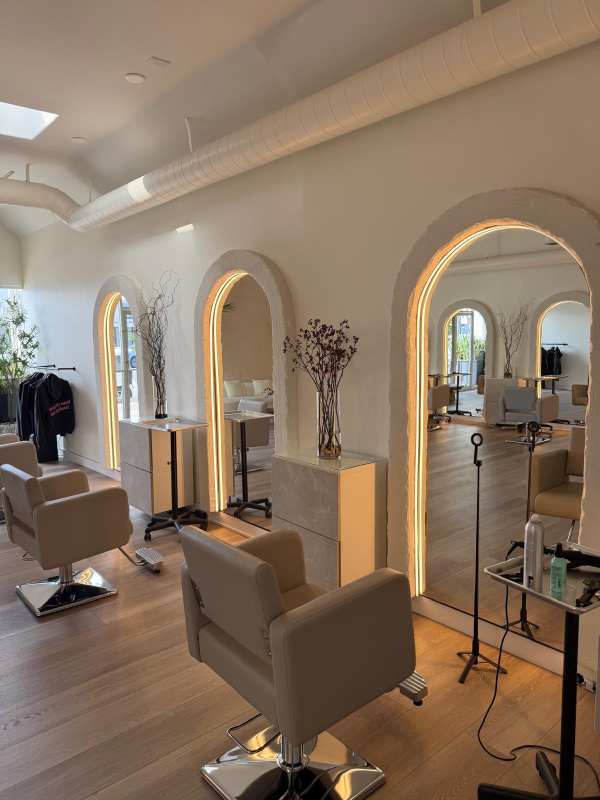 Backlit arches, hand-troweled plaster — a chair for every artist.